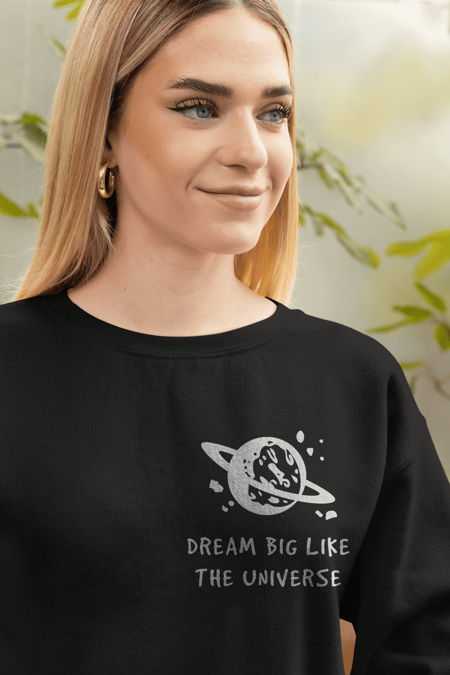 Dream Big Like The Universe Sweatshirt – Women’s Black Oversized Fit | Leversi Woman wearing black “Dream Big Like The Universe” sweatshirt by Leversi