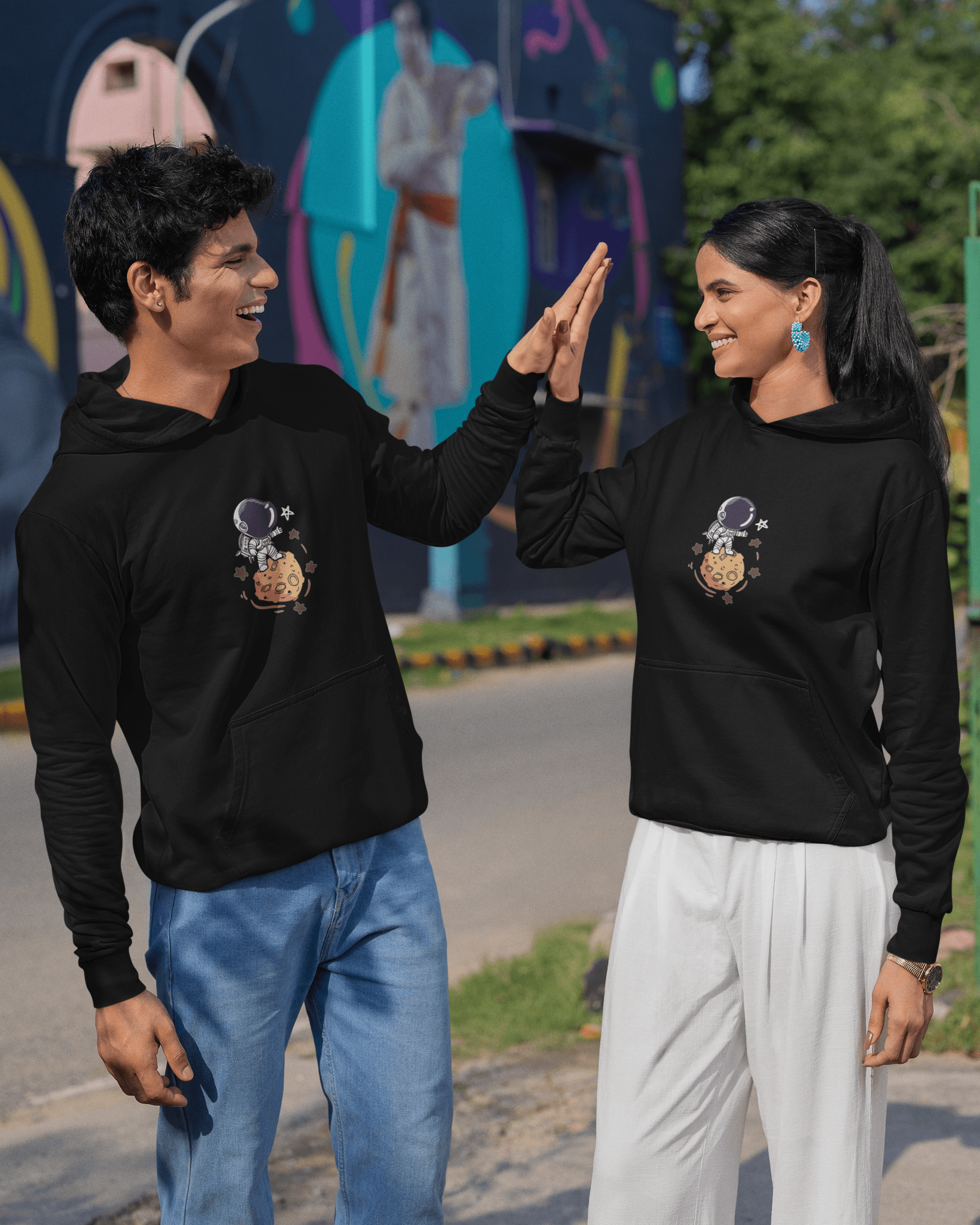 gildan-hoodie-mockup-of-a-happy-man-and-woman-giving-a-high-five-to-each-other-m39144