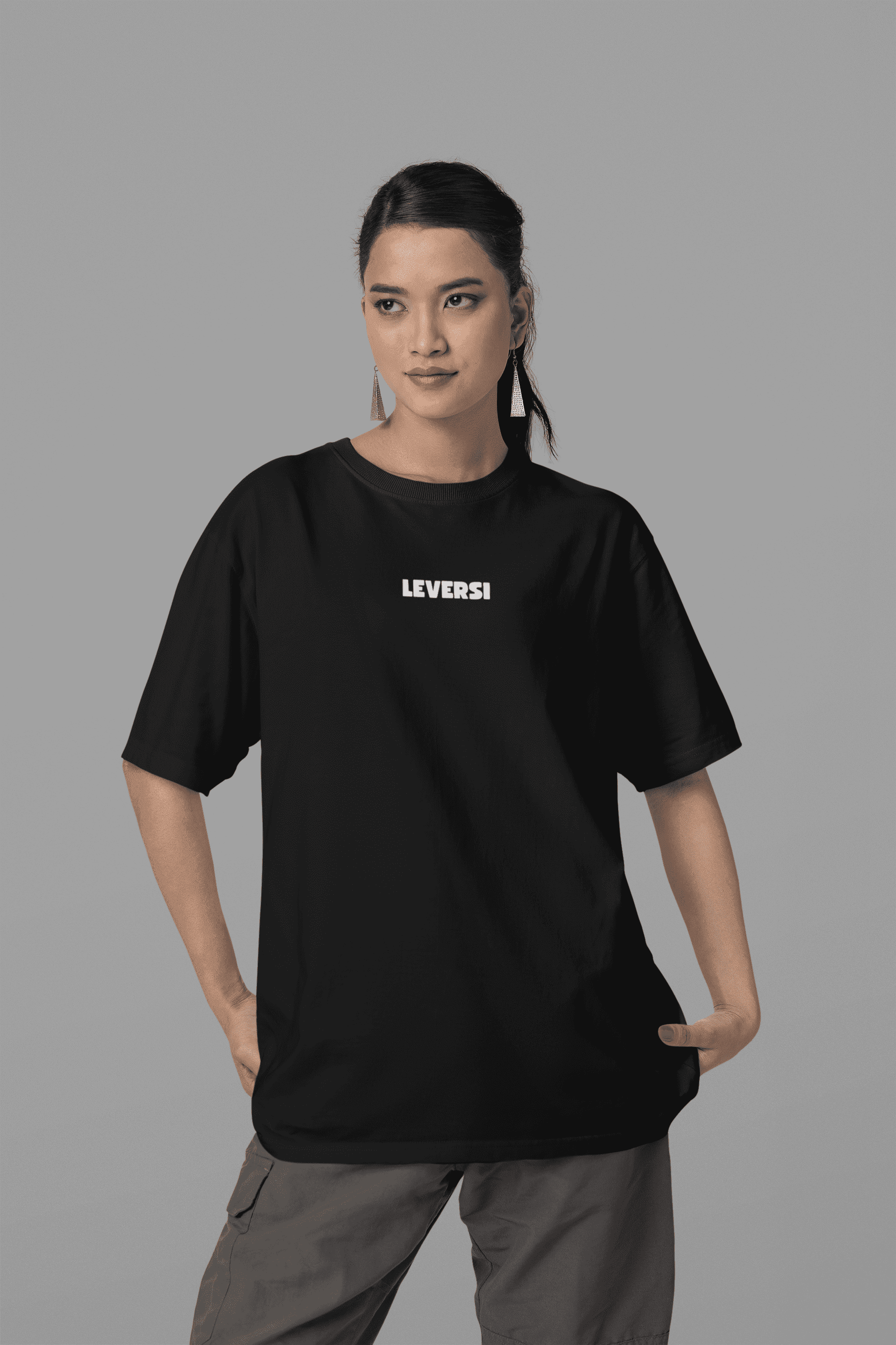mockup-of-a-woman-wearing-an-oversized-blinkstore-tee-in-a-studio-m37650