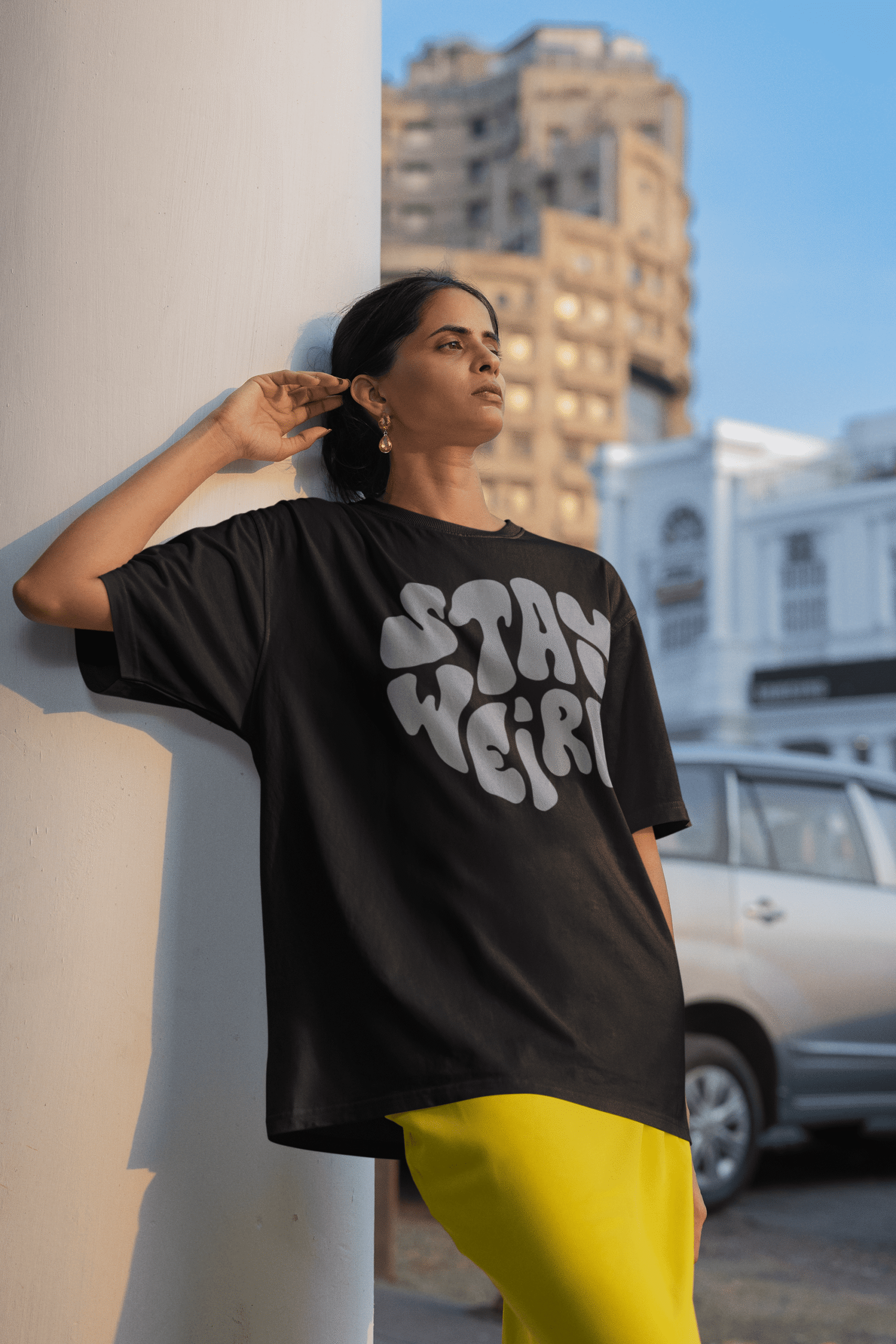 oversized-blinkstore-tee-mockup-of-a-woman-leaning-against-a-column-m39161 (1)