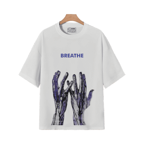 White BREATHE graphic T-shirt with blue abstract hand artwork displayed on a hanger.