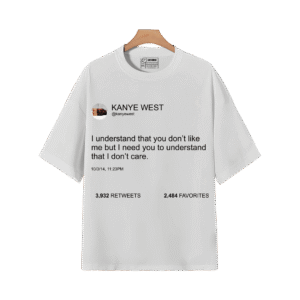 White graphic T-shirt featuring Kanye West tweet quote design on a wooden hanger.