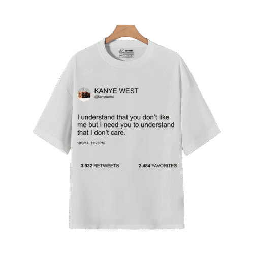 White graphic T-shirt featuring Kanye West tweet quote design on a wooden hanger.