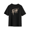 Black T-shirt with a bold, sharp-edged beige “FE!N” graphic printed across the chest in an aggressive, graffiti-inspired style.