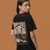 Black T-shirt showing a large cinematic “Travis Scott UTOPIA” back print featuring a sepia-toned image of a figure standing on rocky terrain with dramatic lighting.