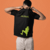 Man lifting his black T-shirt to reveal a neon green JACKBOYS logo and large neon silhouette graphic on the front.