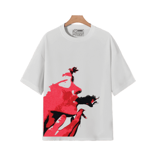 White graphic T-shirt on a hanger featuring a bold red artistic face illustration.
