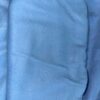 Close-up texture of sky-blue cotton fleece fabric.