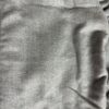 Close-up texture of grey cotton fleece fabric.